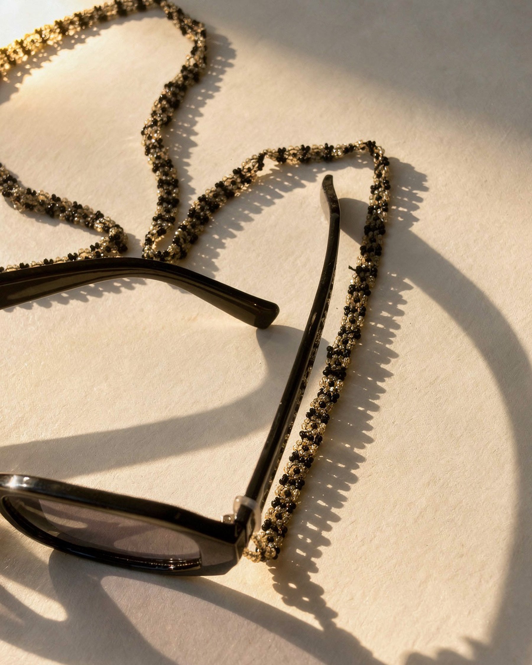 Black and Off-White Beaded Sunglass Chain ACCESSORIES IKKIVI