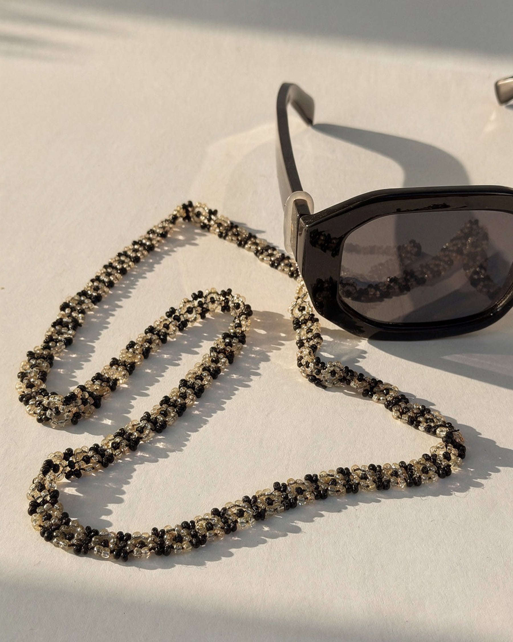 Black and Off-White Beaded Sunglass Chain ACCESSORIES IKKIVI