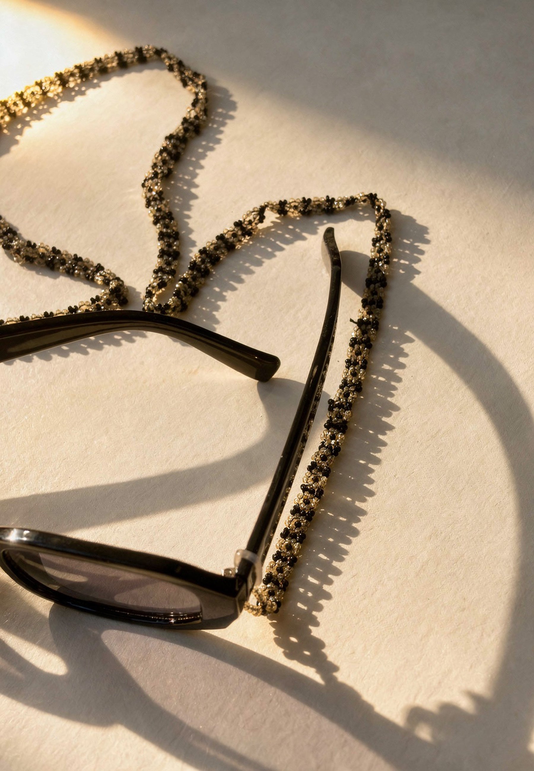 Black and Off-White Beaded Sunglass Chain ACCESSORIES IKKIVI
