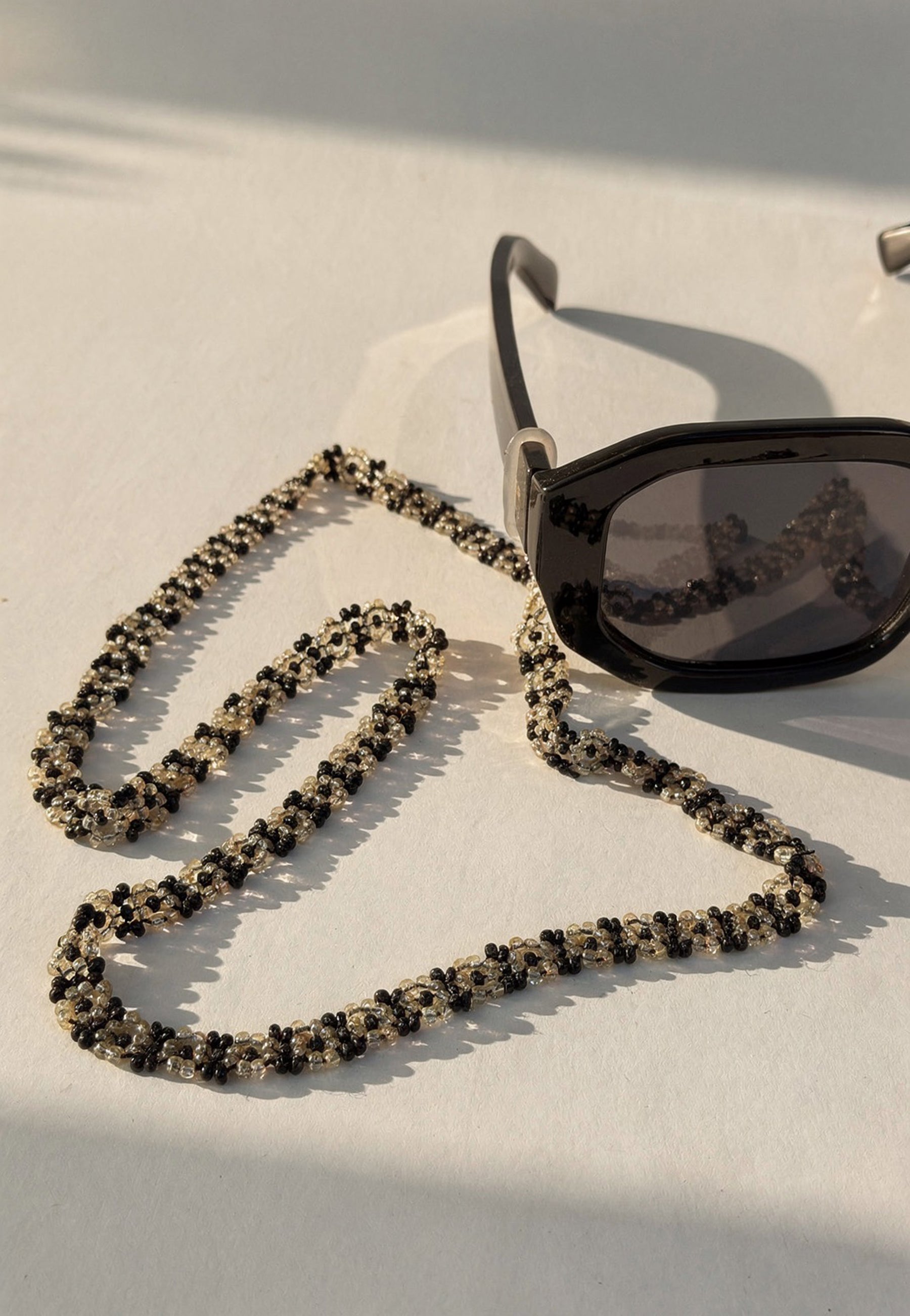Black and Off-White Beaded Sunglass Chain ACCESSORIES IKKIVI